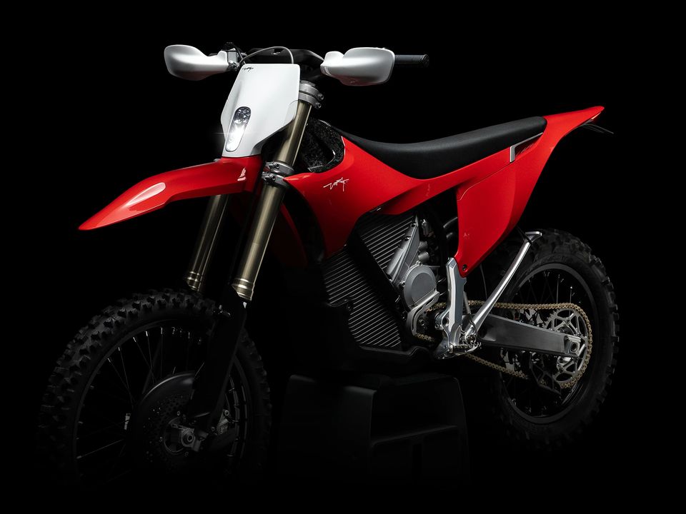 Stark Varg EX electric enduro bike in red with headlight and hand guards