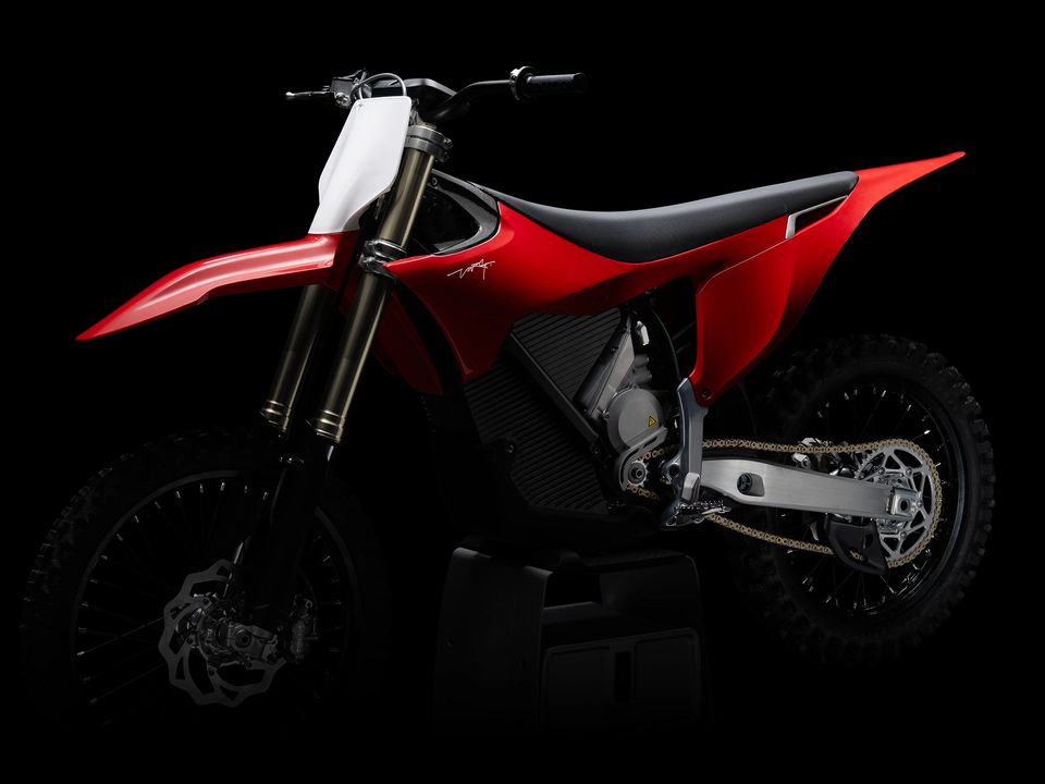 Stark Varg MX electric motocross bike in red, side-on against black